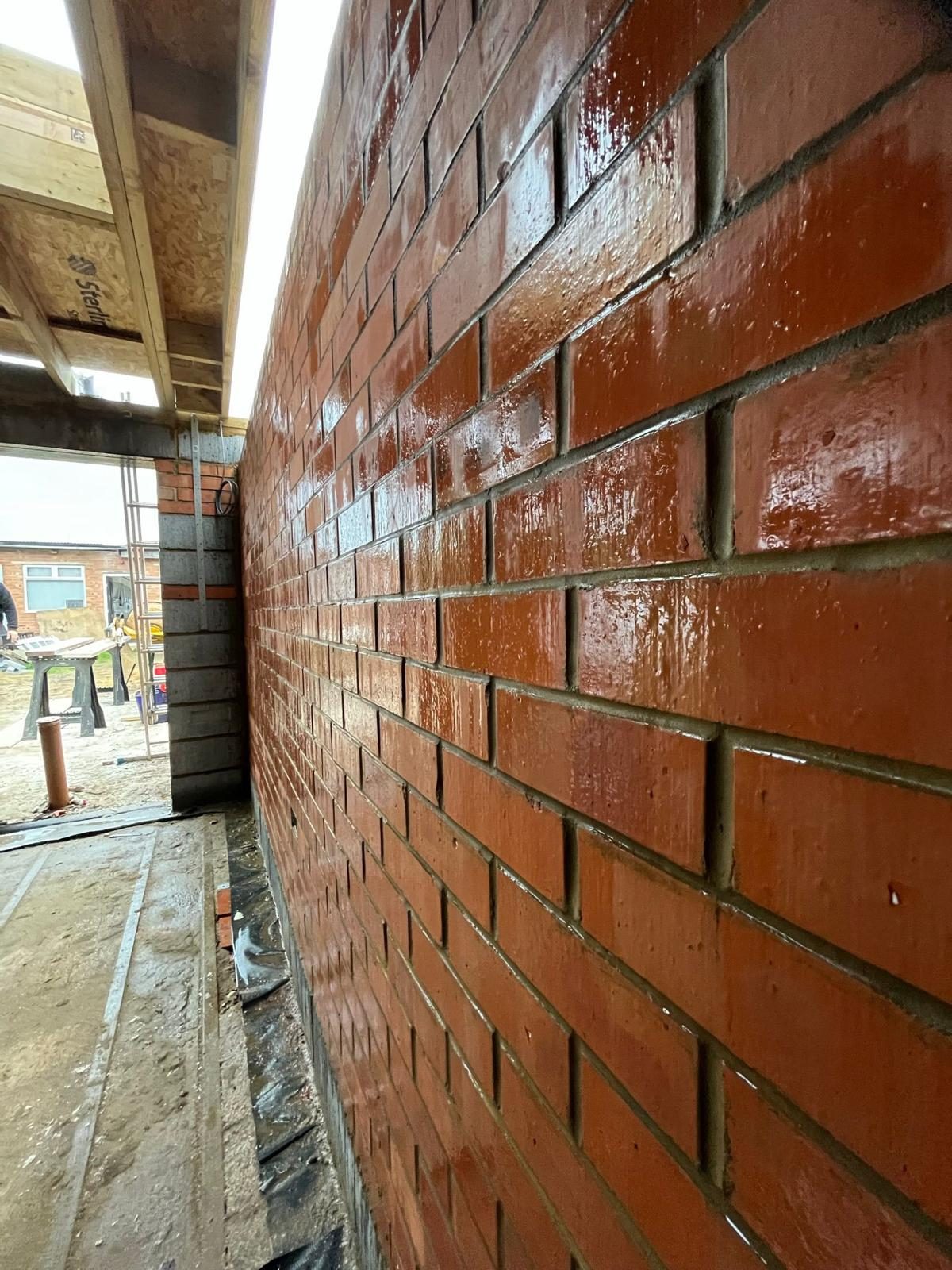 Fresh red brick skin on a new build wall